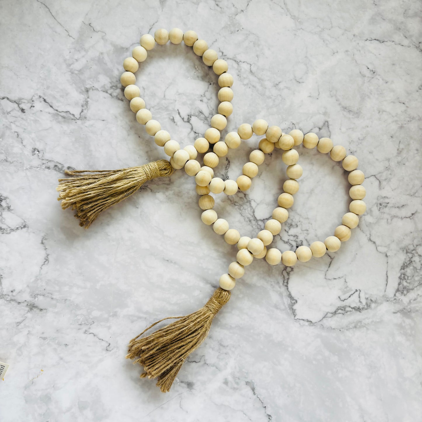 Wooden bead strand with tassels
